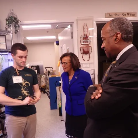 Bohart associate Wade Spencer, an undergraduate student in entomology, shows residents of the live petting zoo to Chancellor Gary May and Helene Dillard, dean of the College of Agricultural and Environmental Sciences. (Photo by Kathy Keatley Garvey)