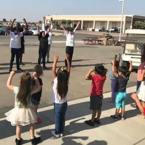 Student teachers lead the physical activity during Week 5