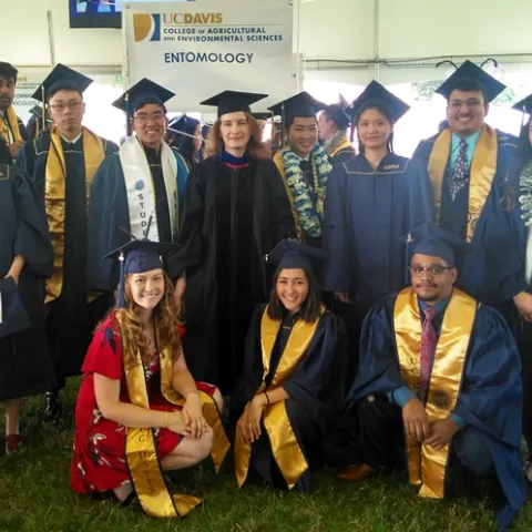 This is the Department of Entomology and Nematology's Class of 2019, with faculty advisor Sharon Lawler, professor of entomology. In front (from left) are Eliza Litsey, Jessica Nguyen and Abram Estrada. In the second row (from left) are Darian Buckman, Lohitashwa Garikipati (without mortarboard and partially hidden), Dingyuan Peng, Seiji Yokota, faculty advisor Sharon Lawler, Michelle Tam, Jo Hsuan Kao, Matthew Salvador, and Rayanh Gutierrez. Not pictured is Jesus Martinez Rodriguez.