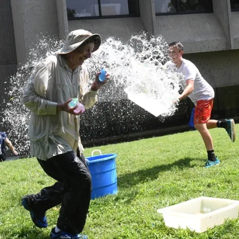 Undergraduate biological sciences major Andrew Kisin of the lab of Alden Gomes, UC Davis Department of Neurobiology, Physiology and Behavior targets distinguished professor and water warrior Bruce Hammock. (Photo by Kathy Keatley Garvey)