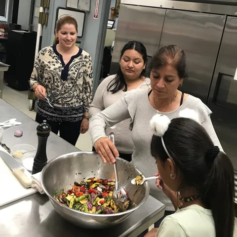 Participants tasting the grilled vegetables.