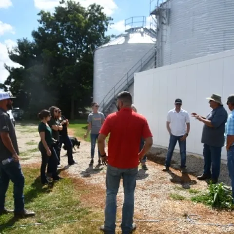 CASI’s Monte Bottens, President of ANP in Moline, IL, and farmer with his dad, Bob Bottens, at Bottens Family Farm in Sherrard, IL hosting a group of California Ag Solutions visitors and Jeff Mitchell on July 31, 2019