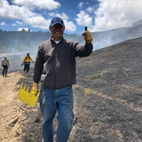 A new Humboldt County PBA participant enjoys his first prescribed burn in June 2019. (Photo: Lenya Quinn-Davidson)