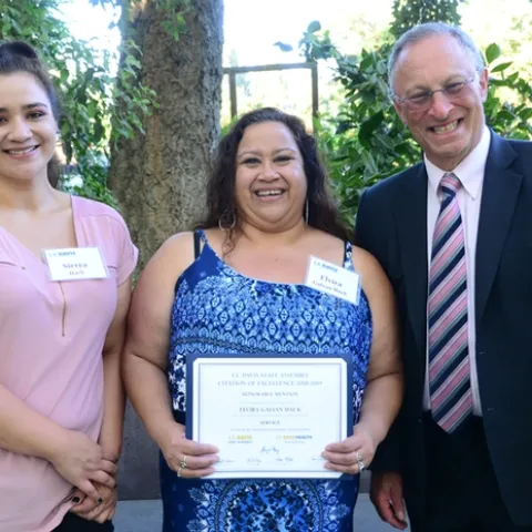 Elvira Galvan Hack (center) with Provost and Executive Vice Chancellor Ralph Hexter, and her daughter, Sierra Hack. (Photo by Kathy Keatley Garvey)