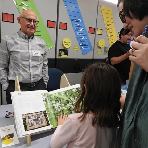 Silkworm moth expert, İsmail Şeker, a Turkish medical doctor and author of a silkworm moth book, answers questions from the crowd at the Bohart Museum open house. (Photo by Kathy Keatley Garvey)