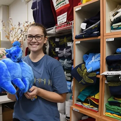 Eliza Litsey, UC Davis entomology alumnus, holds a selection of water bears (tardigrades) in the Bohart Museum of Entomology gift shop. (Photo by Kathy Keatley Garvey)