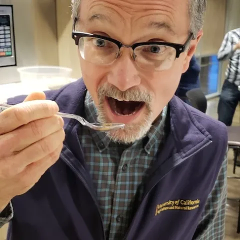 Director of the UC Integrated Pest Management Program, Jim Farrar, eats a bug for breakfast to show his commitment to UC Agriculture and Natural Resources.