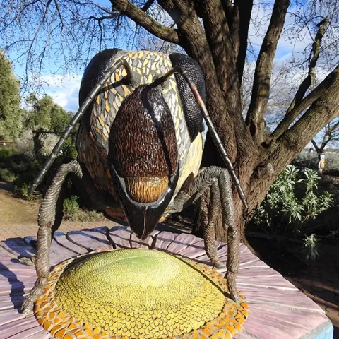 This is the ceramic-mosaic sculpture, "Miss Bee Haven," which anchors the Häagen-Dazs Honey Bee Haven on Bee Biology Road, UC Davis. It is the work of Davis-based artist Donna Billick. (Photo by Kathy Keatley Garvey)