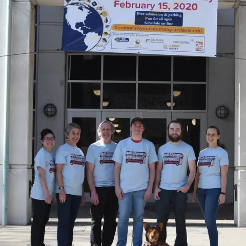 Ready for UC Davis Biodiversity Museum Day are scientists (from left) Ivana Li, biology lab manager; Lynn Kimsey, director of the Bohart Museum of Entomology; Steve Heydon, Bohart Museum senior museum scientist; Lacie Newton, doctoral student, Jason Bond lab; Brennen Dyer, lab assistant, Bohart Museum; and Rebecca Godwin, doctoral candidate, Jason Bond lab. In front is Juniper, Ivana Li's dog. (Photo by Kathy Keatley Garvey)