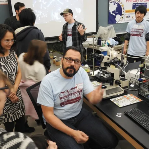 Nematologists Christopher Pagan (foreground) and Corwin Parker, doctoral students in the UC Davis Department of Entomology and Nematology, answer questions from the crowd at the UC Davis Biodiversity Museum Day. (Photo by Kathy Keatley Garvey)