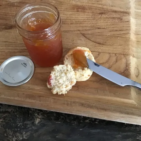 Fresh apricot scone with apricot jam