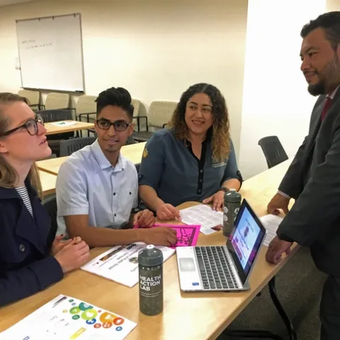 Natalie Price and Stephanie Monterroza (former EFNEP supervisor) working with Food Security Coalition Community partners to increase CalFresh outreach.