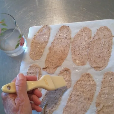 Brushing cracker dough with water(1)