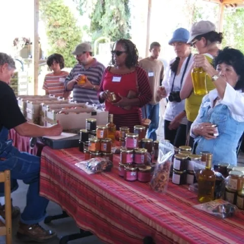 Pre-pandemic, Farmer Al sells products to visitors at Frog Hollow Farms. Agritourism operations have faced drastic business disruptions.