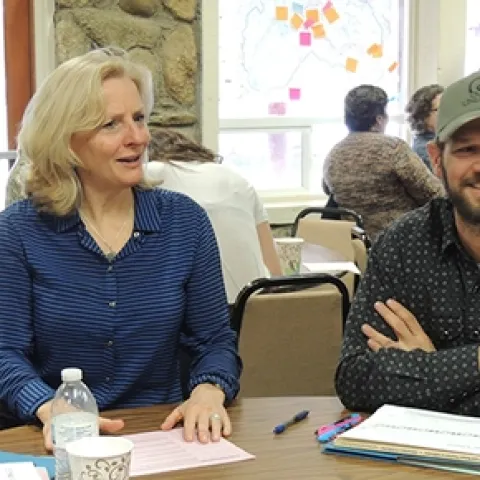 participants at earlier agritourism class work at table
