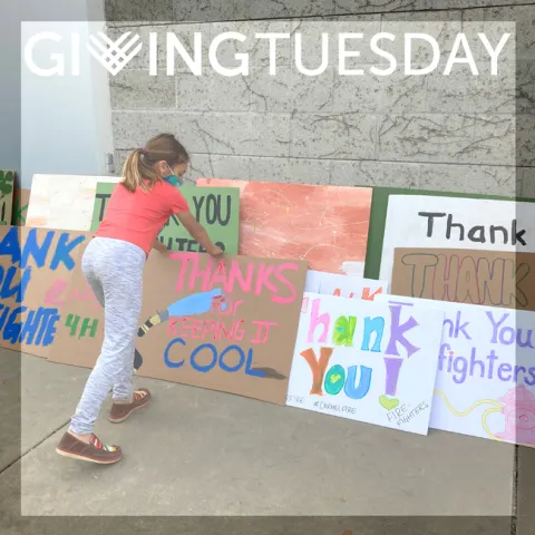 Girl with Thank You Signs