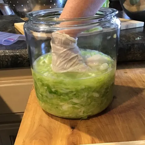 Packing crock with salted cabbage