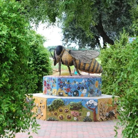 This sculpture of a worker bee anchors the UC Davis Department of Entomology and Nematology's Häagen-Dazs Honey Bee Haven. Titled "Miss Bee Haven," it is by Donna Billick of Davis. (Photo by Kathy Keatley Garvey)