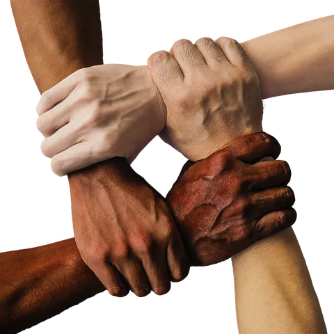 Four hands of light to dark skin color grip the wrist of another to form a closed link.