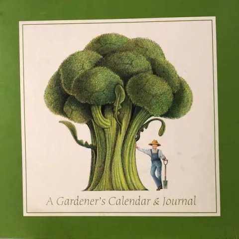 Garden journal with a photo of a man standing with a large broccoli plant.