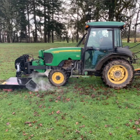 Figure 1. Electric weed control unit manufacturer by Zasso operating at Lewis Brown Research Center in Corvallis, OR. The electricity is applied through the metal probes. The electric resistance heats up the plant, producing steam.