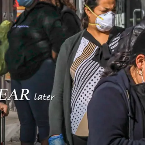 Photo of strangers wearing facemasks on the street. Text reads: One year later.