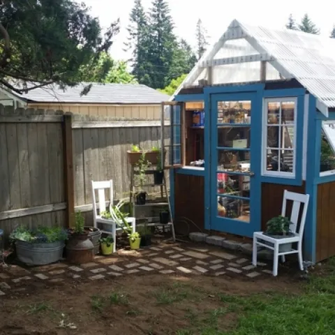 Greenhouse made with old windows and polycarbonate roof. (pinterest.com)