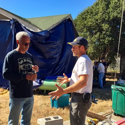 In this image, taken in October 2018, consultant and mentor Vernard Lewis (left), confers with Andrew Sutherland, UC integrated pest management advisor for Bay Area counties, about the Villa Termiti at the UC Berkeley Field Station. Sutherland, who holds a doctorate in entomology from UC Davis, was recently awarded state funding to remodel the Villa for future training of pest management professionals in the state. (UC ANR Photo by Pam Kan-Rice)