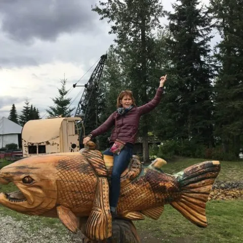 Debra Driskill, shown riding high in Alaska, retired from UC ANR in January.