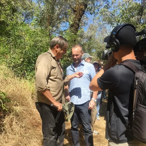 California dogface butterfly expert Greg Kareofelas (far left) chats with Rob Stewart of the PBS program, "Rob on the Road."