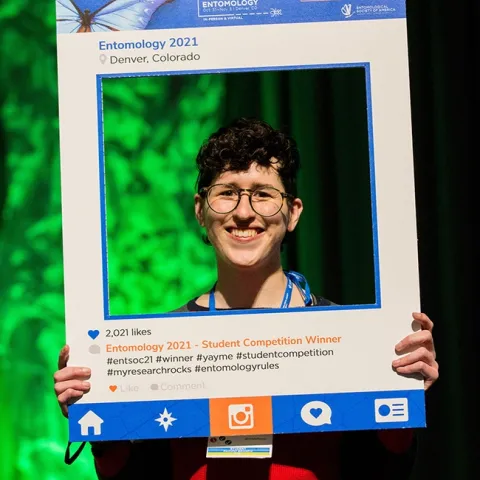 UC Davis doctoral student Danielle Rutkowski--framed--as the winner of a President's Prize at the Entomological Society of America meeting. (Photo by Entomological Society of America/Photography G)