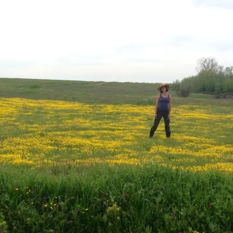 Julia Michaels in a field of upland blooms