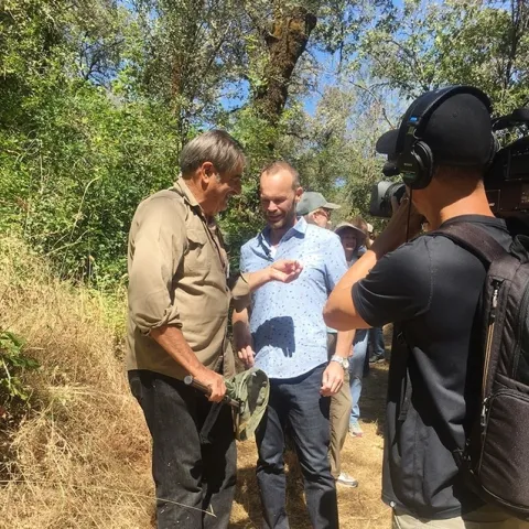 Greg Karefelas (left), an associate at the Bohart Museum of Entomology, shares his expertise of the California dogface butterfly with Rob Stewart of the TV program, "Rob on the Road."