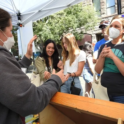 Tabatha Yang, the Bohart Museum of Entomology's education and outreach coordinator, "talks bugs" with visitors at the California Honey Festival. (Photo by Kathy Keatley Garvey)