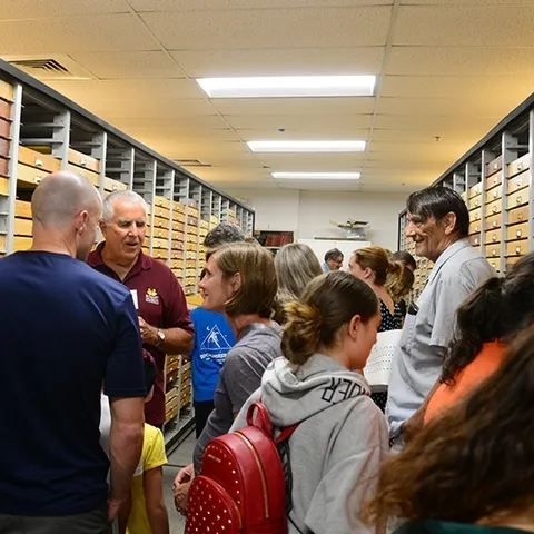 Entomologist Jeff Smith (second from left), curator of the Bohart Museum's Lepidoptera collection, talks to visitors at a recent Moth Night. (Photo by Kathy Keatley Garvey)