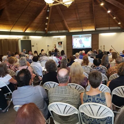 A capacity crowd attended the memorial for UC Extension apiculturist Eric Mussen in the Putah Creek Lodge, UC Davis. (Photo by Tabatha Yang)