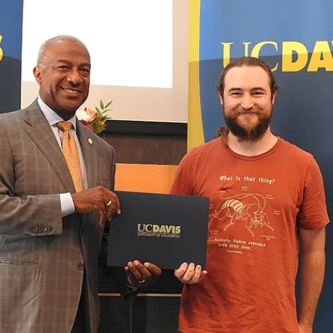 UC Davis entomologist Brennen Dyer, a lab assistant at the Bohart Museum of Entomology, with UC Davis Chancellor Gary May. (Photo by Kathy Keatley Garvey)