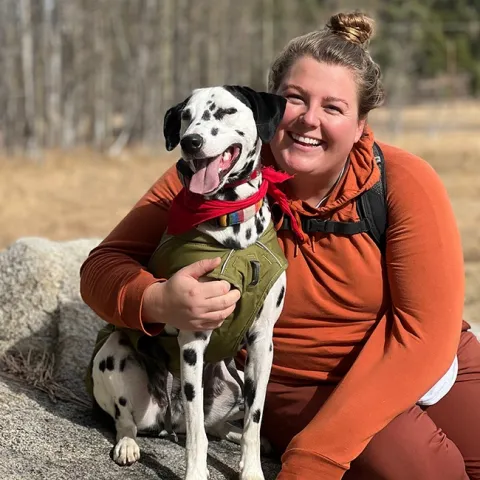 UC Davis doctoral candidate Olivia Winokur, who will complete her dissertation in October, cuddles her 2.5-year-old adopted Dalmatian, Scotty.