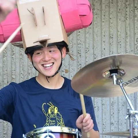 Yao Cai dressed as a fruit fly to play the drums in The Entomology Band at the 2018 UC Davis Picnic Day. (Photo by Kathy Keatley Garvey)