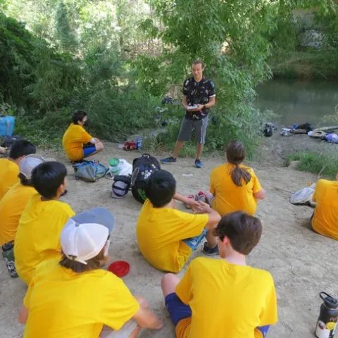 UC Davis student Christofer Brown presents a program on dragonflies to middle schoolers enrolled in the UC Davis Bio Boot Camp, held in the summer of 2022. This image was taken by Putah Creek. (Tabatha Yang Photo)