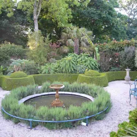 Lavender rings a bird bath in a formal 18th-century style garden in Cornwall, England. J. Lawrence