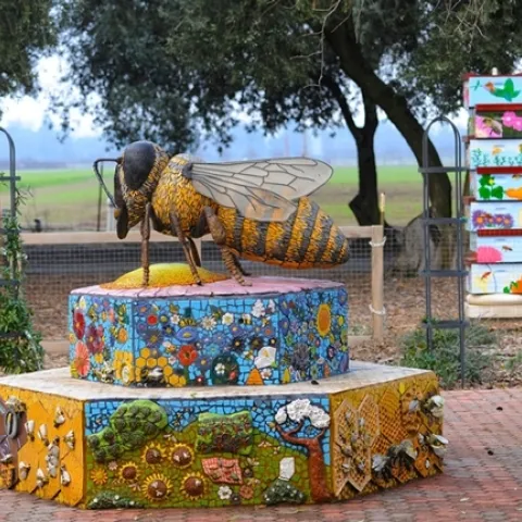 A mosaic-ceramic sculpture of Miss Bee Haven, the work of Donna Billick of UC Davis, anchors the UC Davis Bee Haven. (Photo by Kathy Keatley Garvey)
