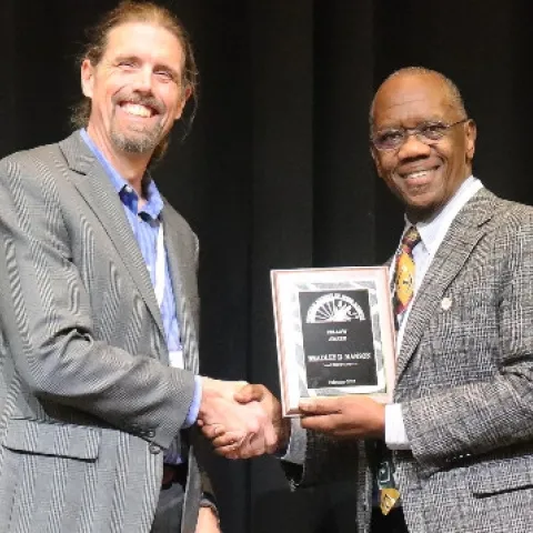 Brad Hanson (left) receives Fellow Award from WSWS President Joel Felix (photo credit: A.L. Simoes Araujo)