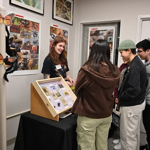 UC Davis doctoral student Emma Jochim answers questions at her station. (Photo by Kathy Keatley Garvey)