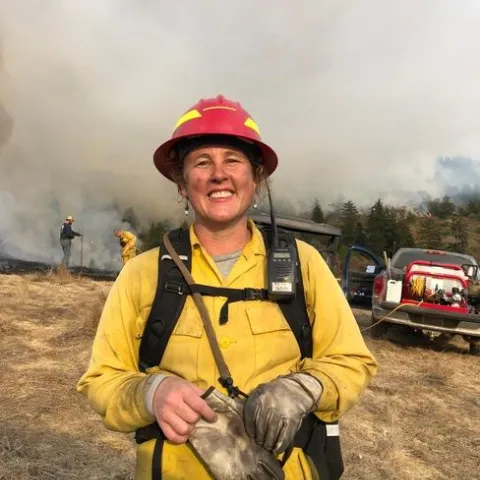 Lenya is wearing bright yellow protective gear.
