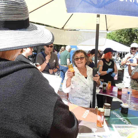 Amina Harris, director of the UC Davis Honey and Pollination Center, and co-founder of the California Honey Festival, talks about honey. (Photo by Kathy Keatley Garvey)