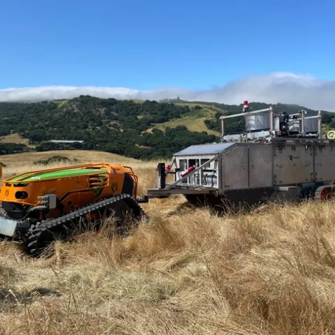 The burn bot unit burns and extinguishes vegetation in an enclosed, controlled environment.