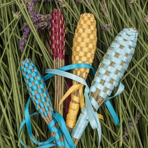 Lavender wands wrapped with colorful ribbons.