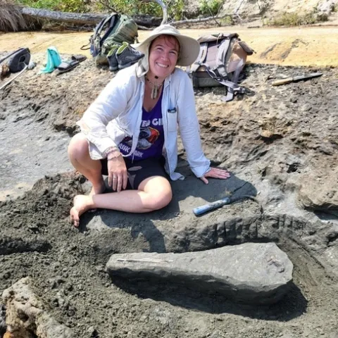 UC Davis alumna Emily Bzdyk with the 15-million-year-old fossil skull of a dolphin she found at Chesapeake Bay, Calvert County, Maryland