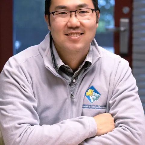 Danny is wearing a jacket sporting the UC Master Gardener logo.